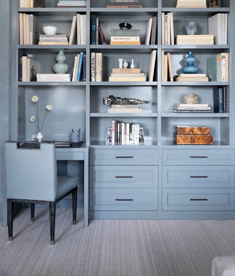 Painted built-in bookcase with an integrated desk