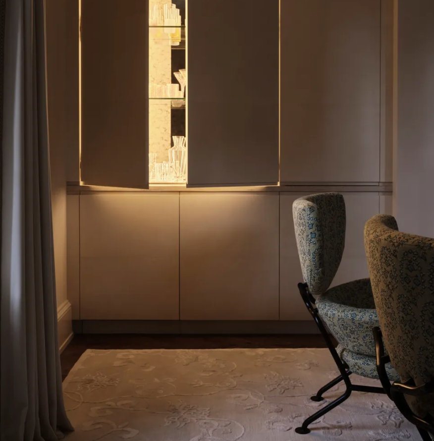 Paneled wall with a lit niche