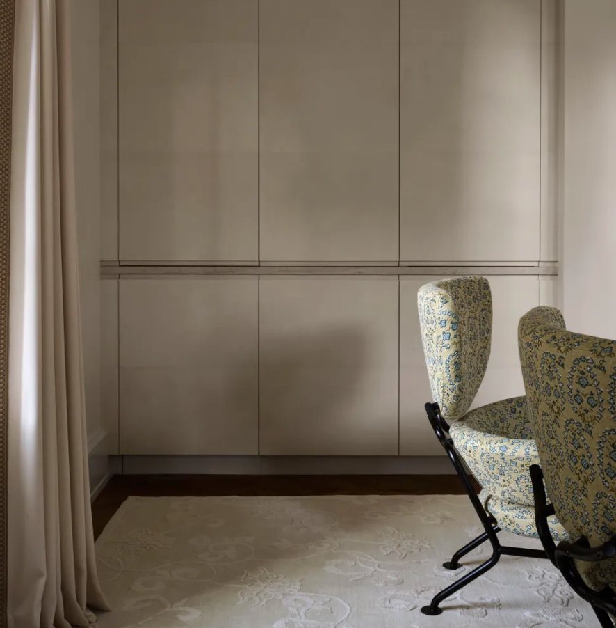 Paneled wall with concealed doors
