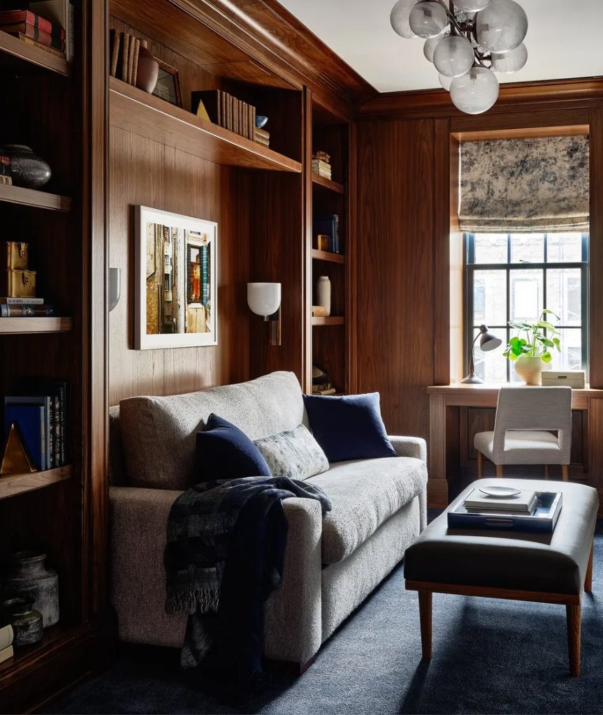 Wood-paneled library with built-in shelving